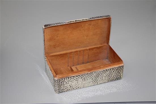 An Edwardian planished silver mounted rectangular cigarette box, Joseph Braham, London, 1903, 18cm, gross 21 oz.